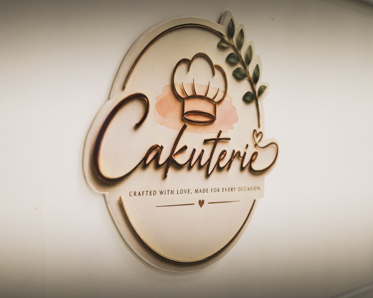 Cakuterie logo sign mounted on the front of the cart