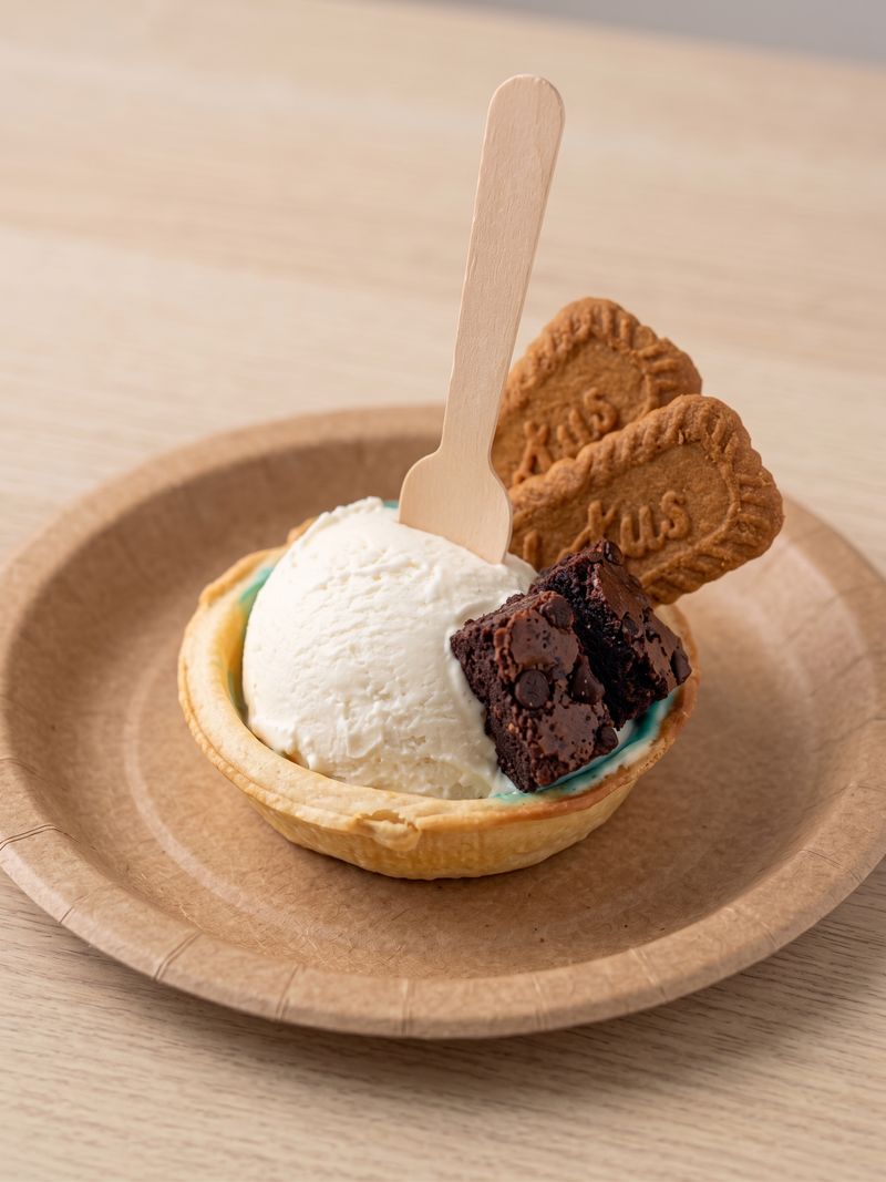 Ice cream in a tart shell with a brownie and Biscoff cookies
